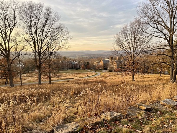 A serene nature view around the men's addiction treatment campus features rolling hills and native Oklahoma grasses.
