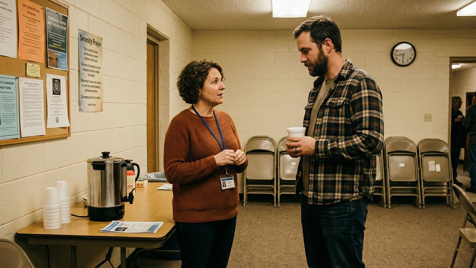 A medical professional talks to a man during a detox consultation at the residential treatment center.