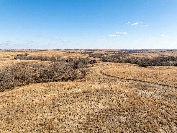 Serene nature and rolling hills on the men's rehab campus at midday in Oklahoma offer a peaceful setting for recovery.