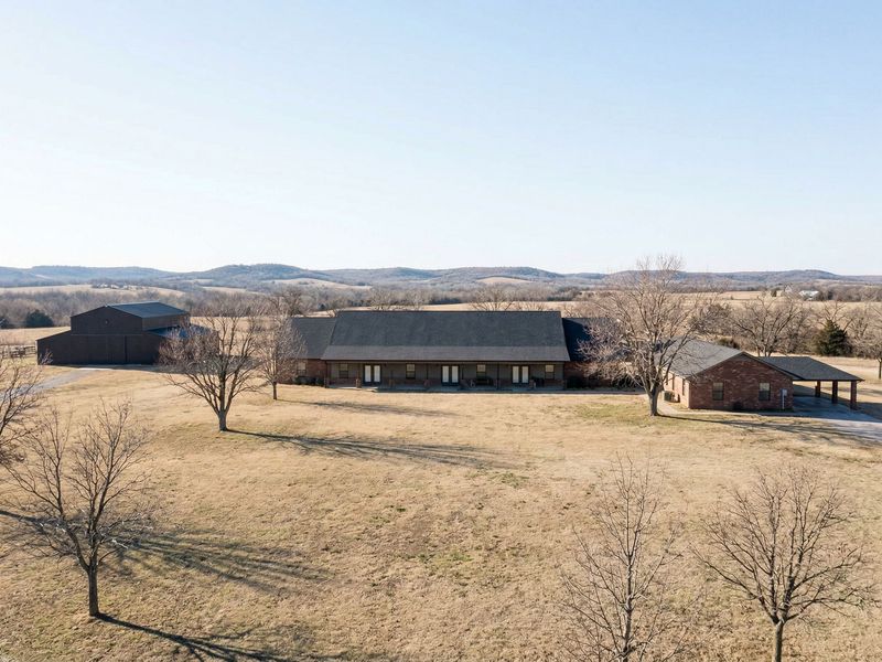 A peaceful and natural campus setting features dry grass and trees that promote deep healing and spiritual connection.