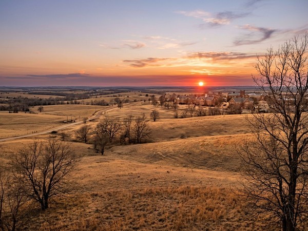 Serene nature around the men's rehab campus at sunset in Oklahoma creates a peaceful environment for evening reflection.